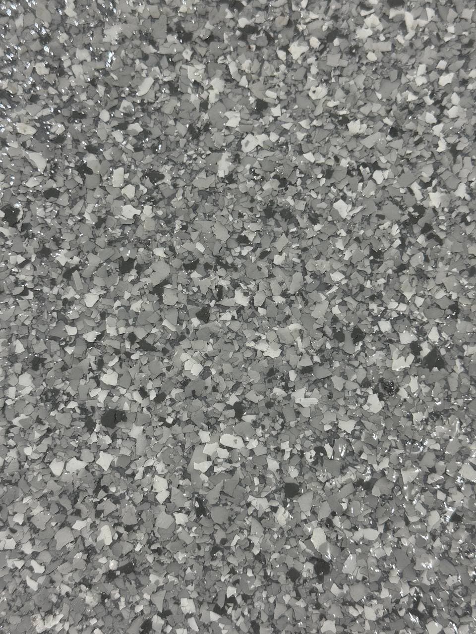 Close up of a finished flake and topcoat surface