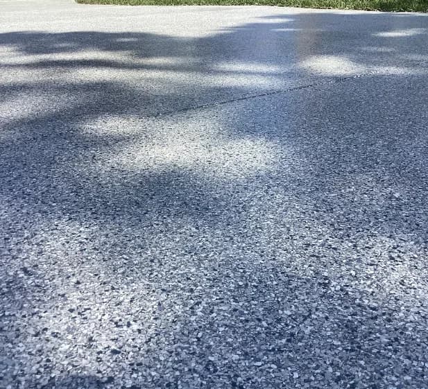 A finished garage floor where a car parks