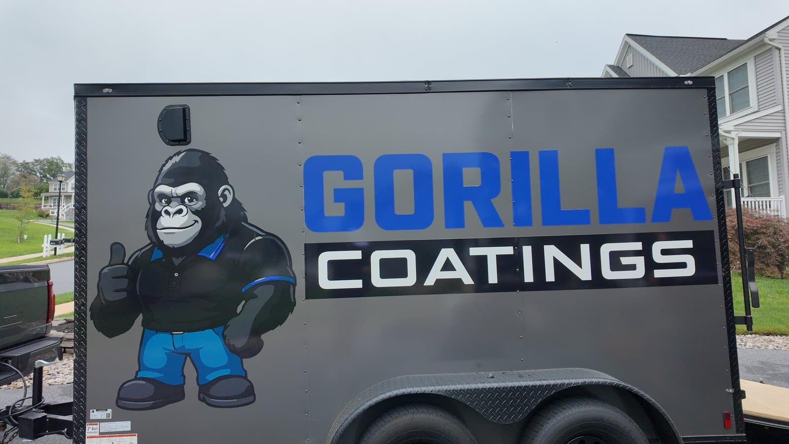 The Gorilla Coatings trailer parked at a job site