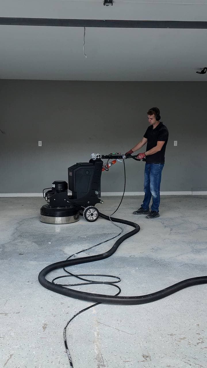 Crew running equipment during a garage install