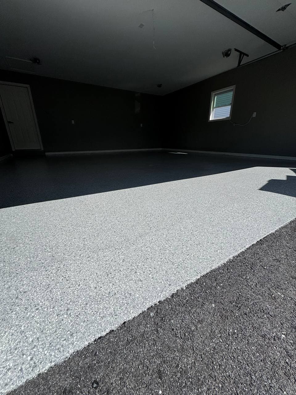 Finished garage floor photographed at dusk