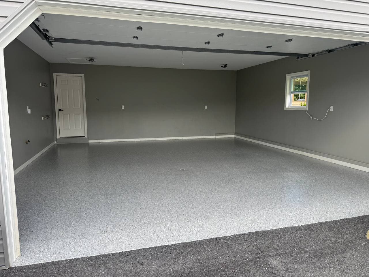 Finished gray flake floor in a two car garage